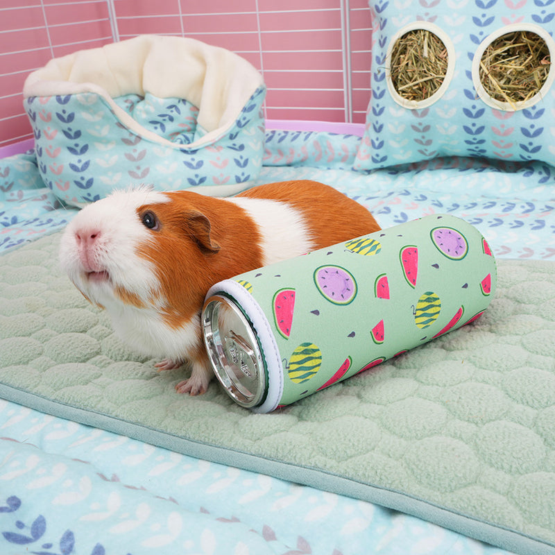 brown and white guinea pig in white kavee c&c cage surrounded by kavee fleece accessories next to freezable bottle