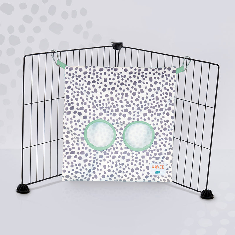 Kavee dalmatian print haybag hanging from two black c&c grids on grey spotted background