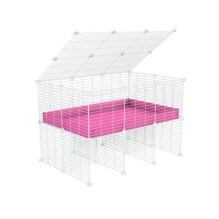 a 3x2 C&C cage for guinea pigs with a stand and a top pink plastic safe white grids by kavee