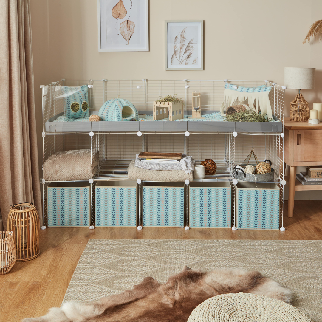 Living room with kavee c and c white grid cage with scandi abstract storage box fleece liners and accessories