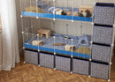 A two tier white 4x2 c&c cage with stand and side storage for guinea pigs with two levels black correx baby safe grids by brand kavee in the USA