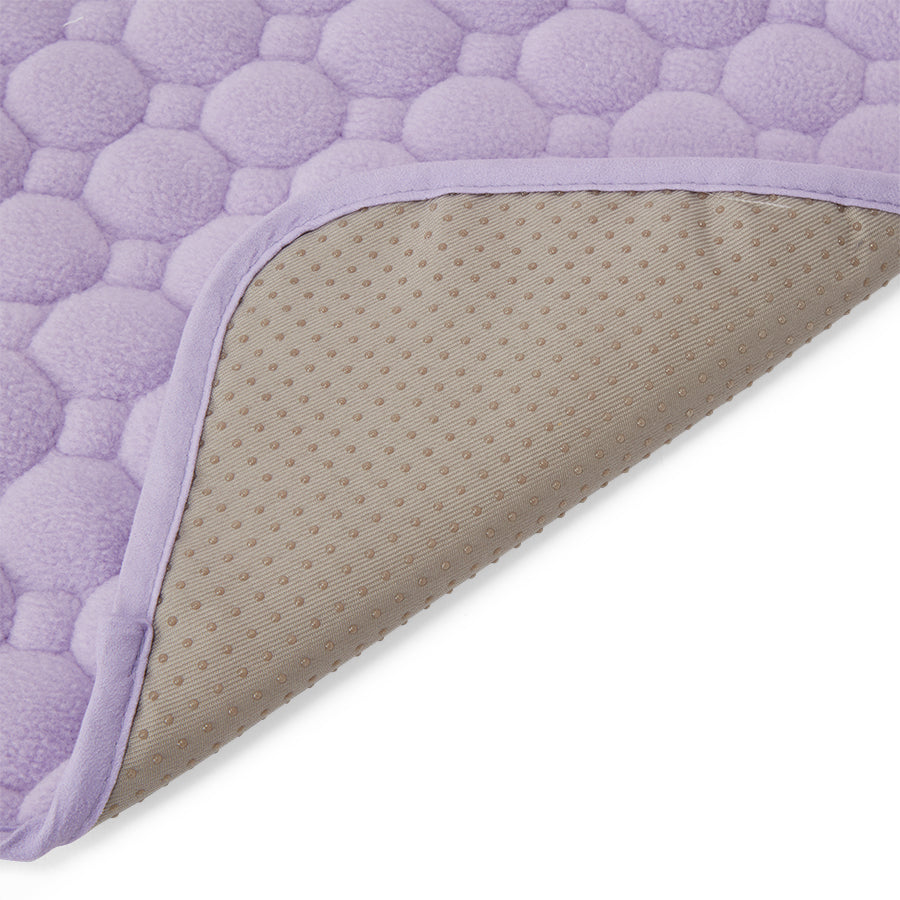 An image of the inside corner of Kavee's waterproof guinea pig lap pad in lilac